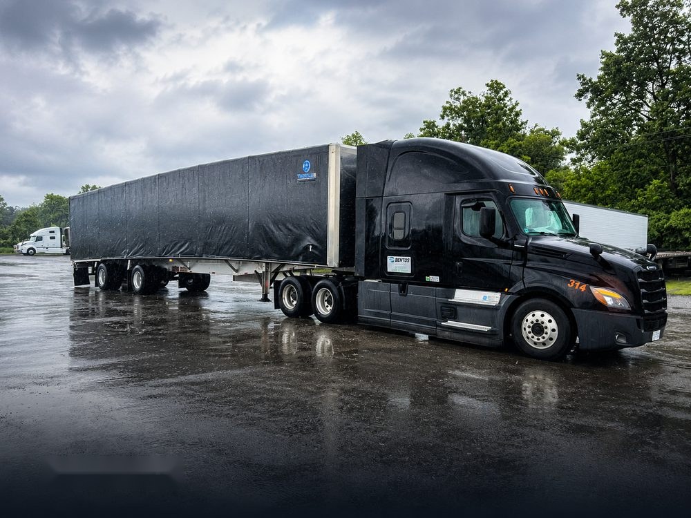 BENTOS Freightliner with Conestoga rolling-tarp trailer