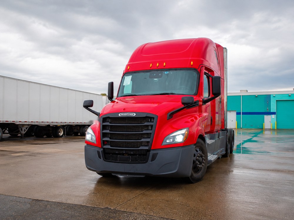 Red BENTOS Freightliner Cascadia at the loading dock
